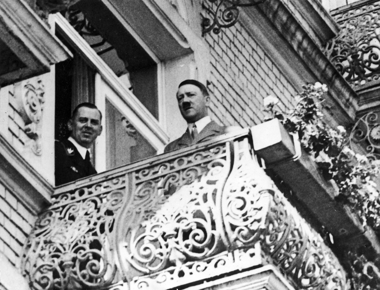 Adolf Hitler and Julius Schaub on the balcony of Hotel Dreesen in Bad Godesberg waiting for the arrival of Neville Chamberlain before their official meeting